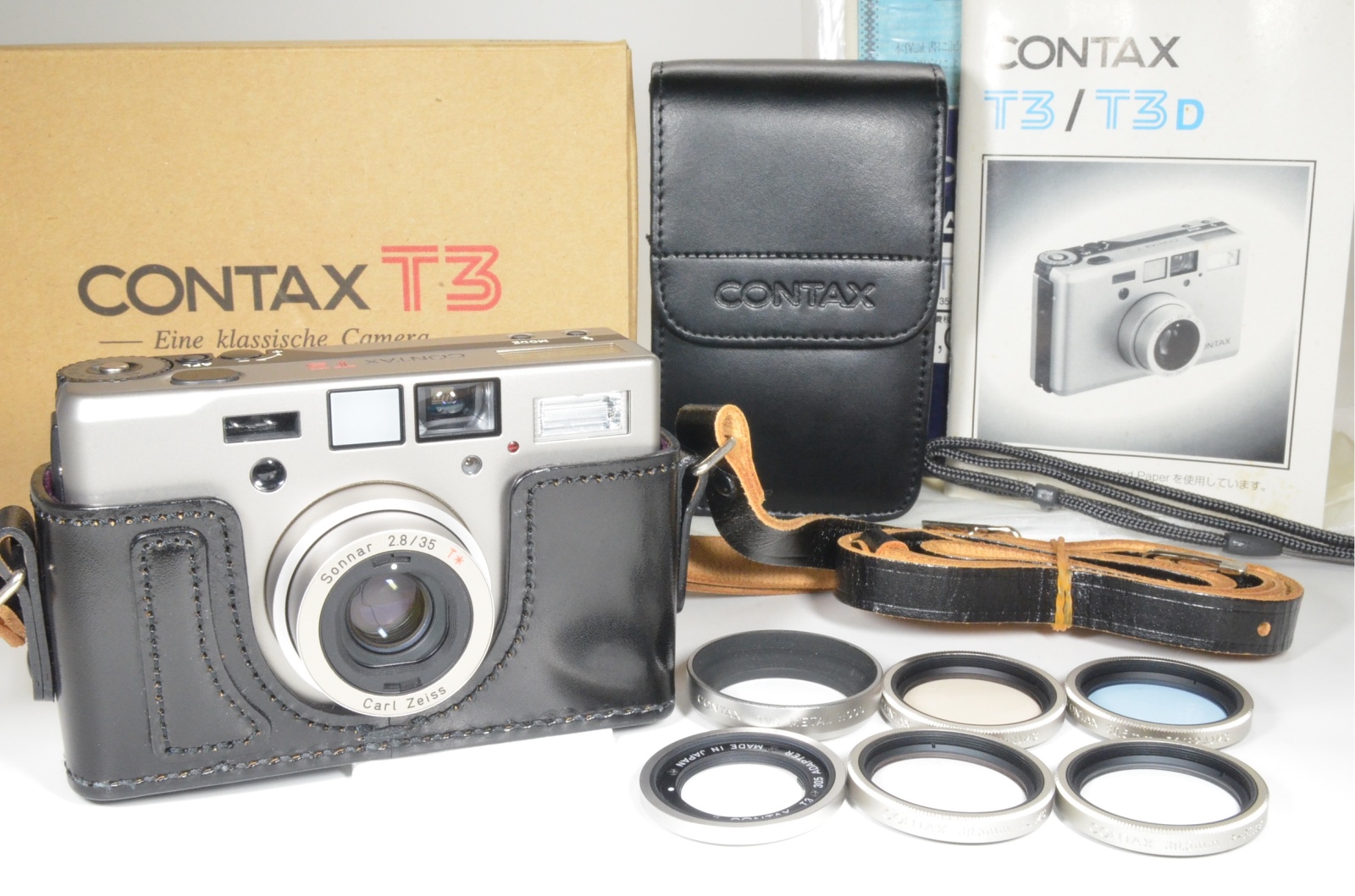 contax t3 in boxed with hirai case, lens hood and 4 filters
