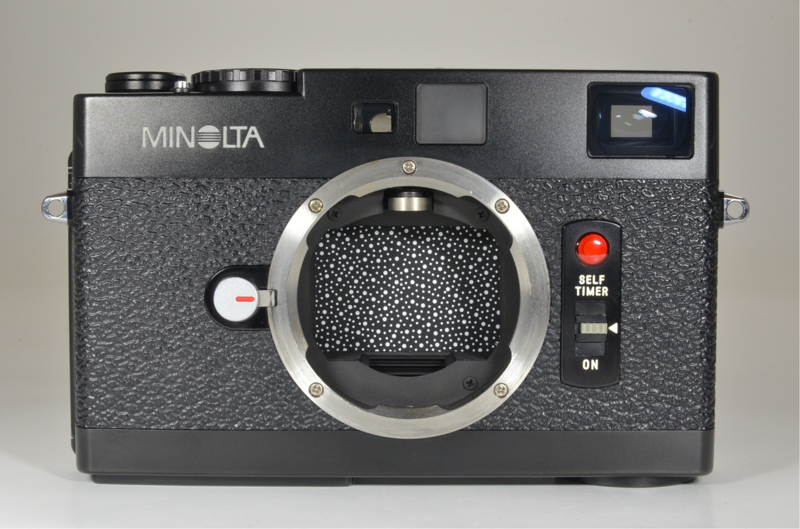 minolta cle 35mm film camera, m-rokkor 40mm f2, 90mm f4, grip and cable release