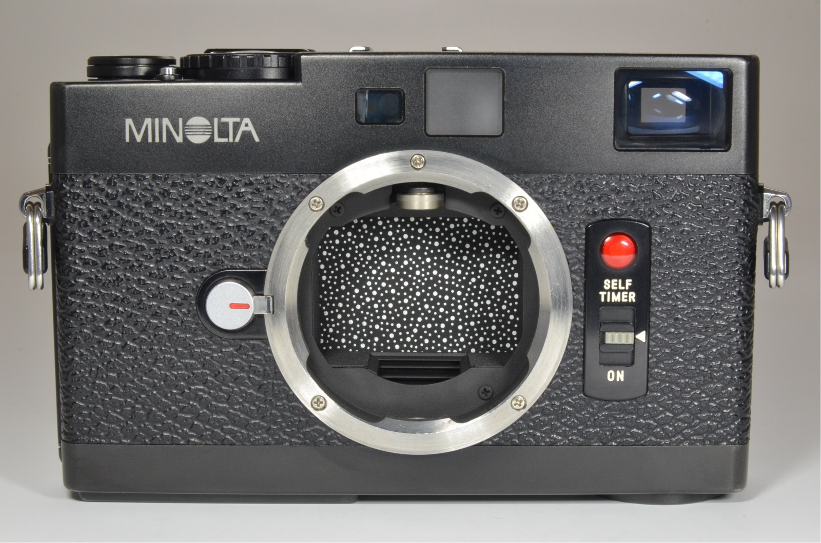 minolta cle 35mm film camera with lens m-rokkor 40mm f2, 90mm f4 and 28mm f2.8