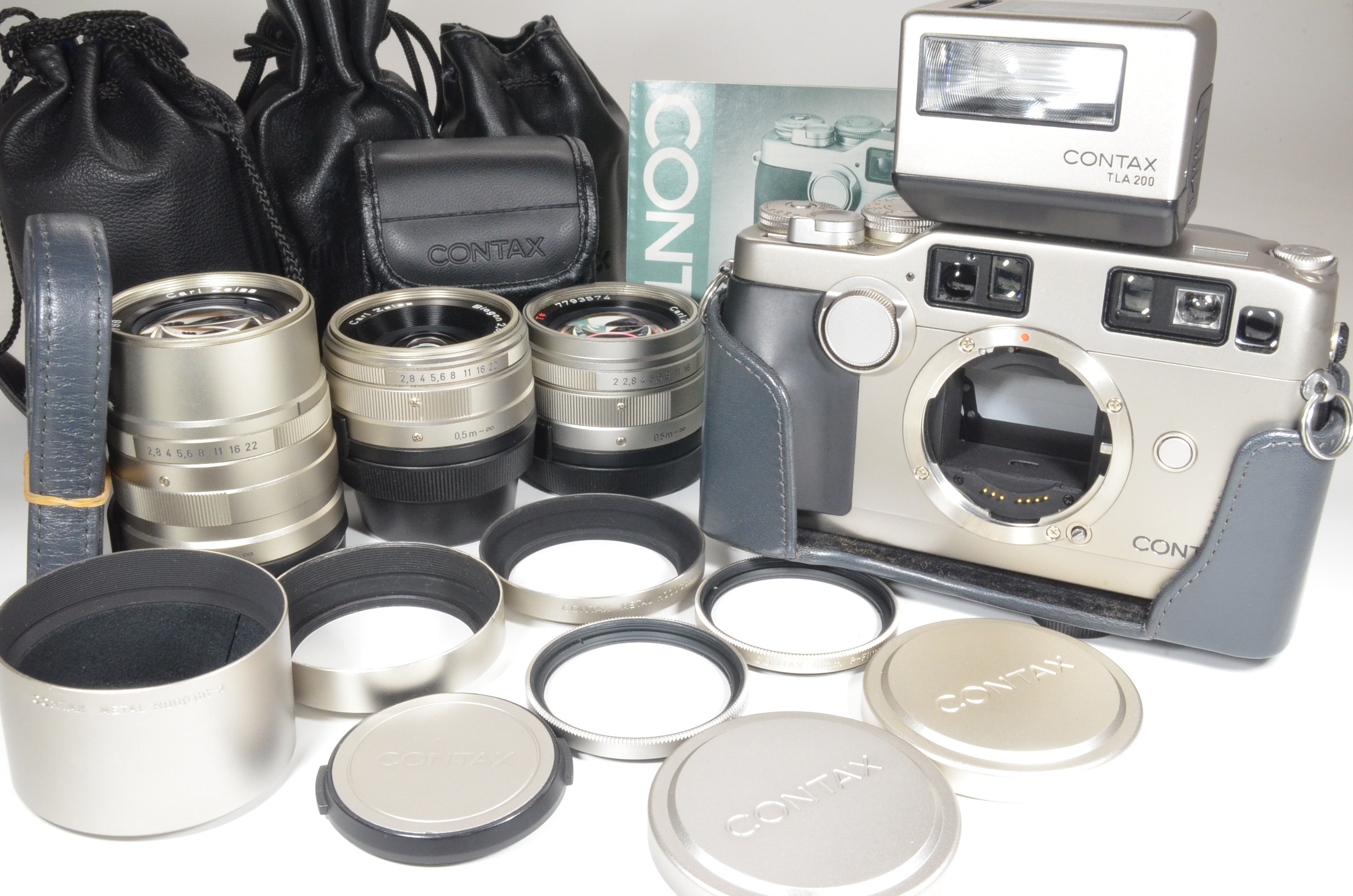 contax g2 with half case, planar 45mm, biogon 28mm, sonnar 90mm and tla200