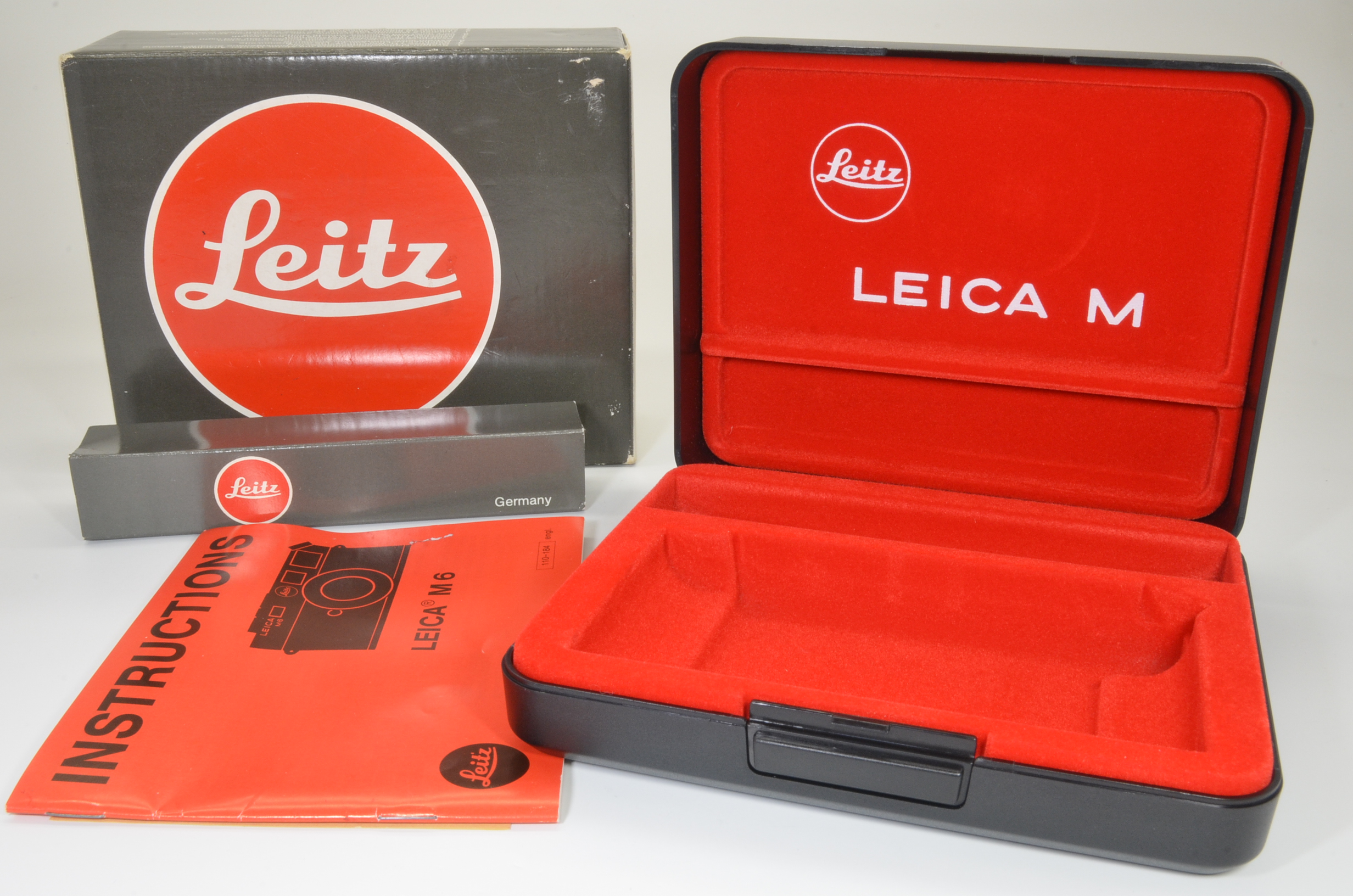 leica m6 empty box, plastic case, and english instructions