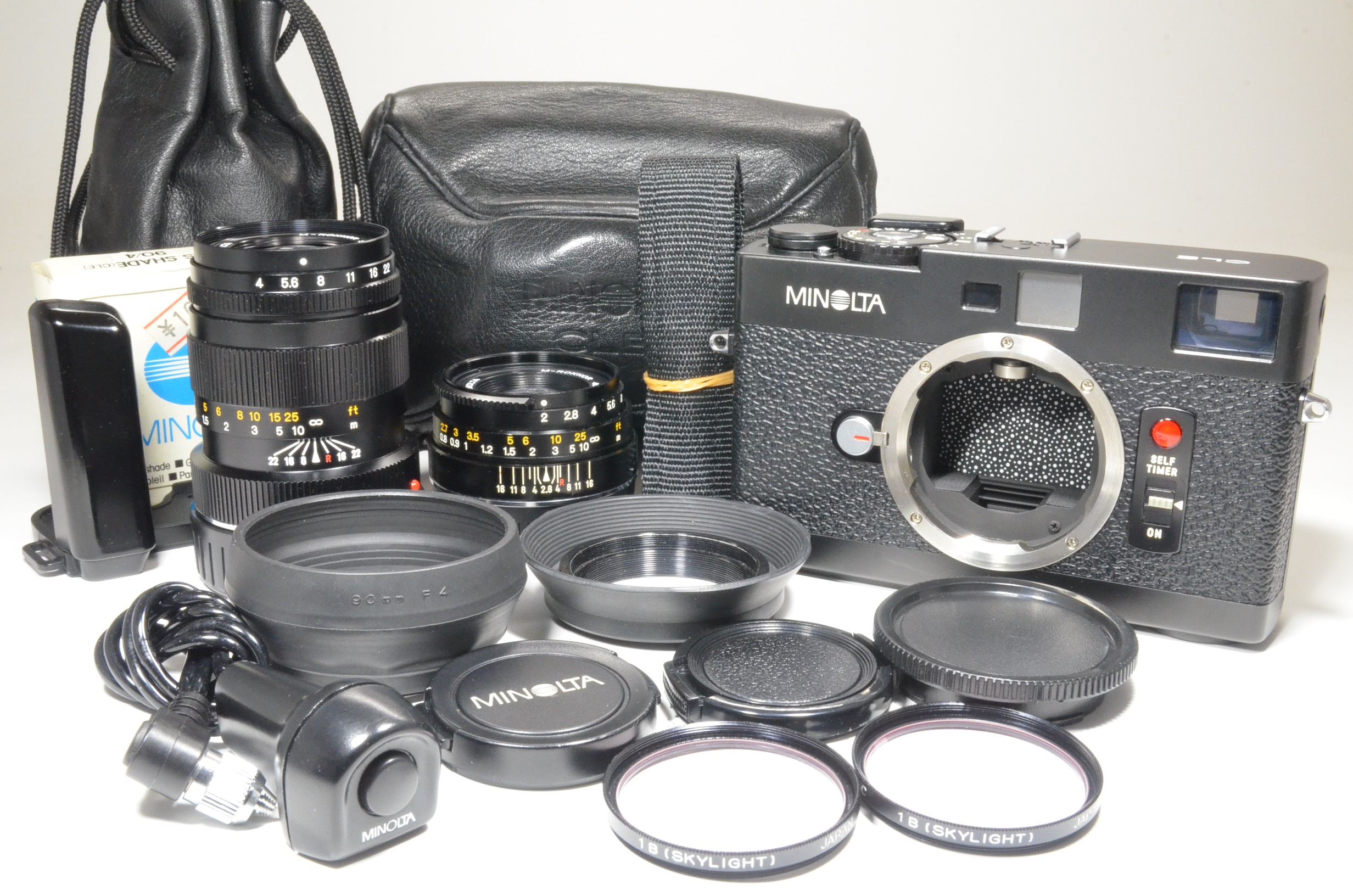 minolta cle 35mm film camera, m-rokkor 40mm f2, 90mm f4, grip and cable release